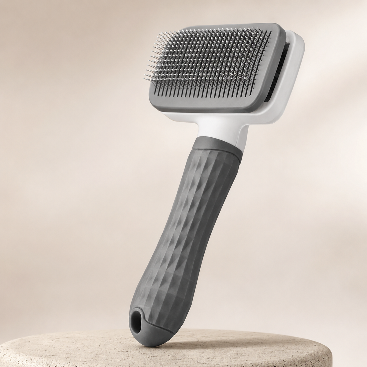 2-in-1 self-cleaning pet grooming brush in a premium studio setting